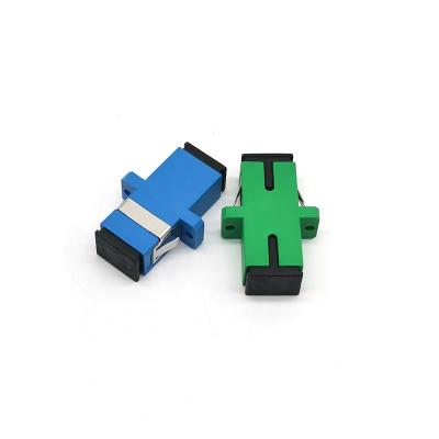 China FTTH Blue Ceramic PVC SC/UPC SC/APC Singlemode Simplex Fiber Optic Adapter With Ear for sale