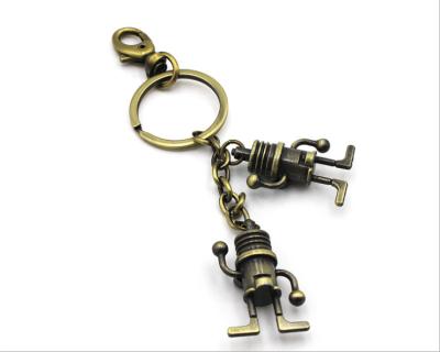 China Retro Metal Key Chain Pendant Jewelry Space Robot Wholesale Universal Lock Ring for sale