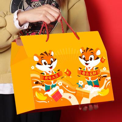 China Recycled Materials Lucky Gift Box Holiday Packaging Paper Candy Paper Bag Chinese New Year Gift Box New Year Gift Box for sale