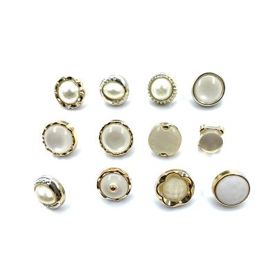 China Custom Golden Embossed Dome Women's Logo Viable Clothing Buttons Sewing Buttons Pearl Rivet Buttons for sale