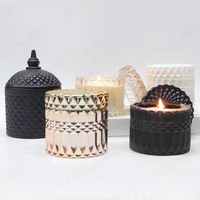 China Transperant Glass Jar Candle Vessel Luxury Embossed Candle Jar With Lid for sale