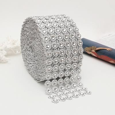 China Durable Garment Accessories 1 Roll 6 Row Silver Sunflower Rhinestone Crystal Pp Flower Mesh Wrap Ribbon For Clothing Accessories for sale