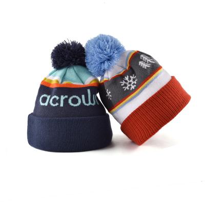 China Custom 100% Acrylic COMMON Jacquard Knit Beanies With Pom Wholesale Winter Hats With Ball On Top for sale