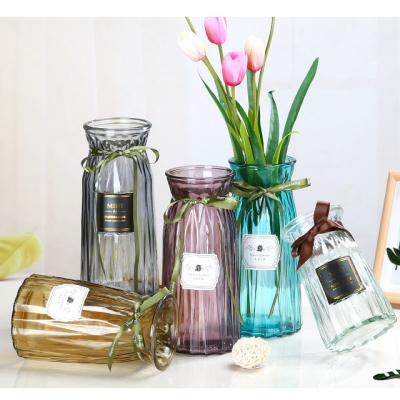 China Art Decor Wholesale European Small Living Room Glass Dining Table Vase Mouth Home Flower Bottle Crafts for sale