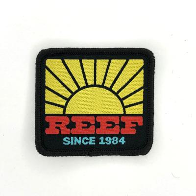 China Viable High Quality Custom Self-adhesive Brand Logo Badge Woven Embroidered Patch For Apparel for sale