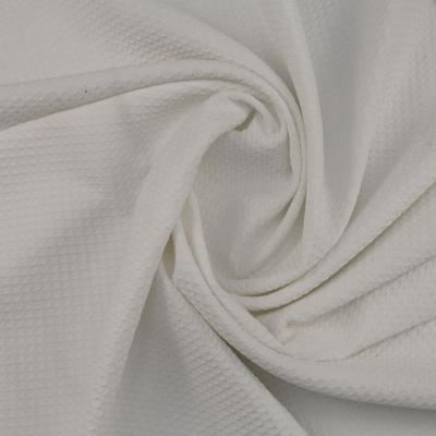 China Stock Sale White 100% Shrink-Resistant Polyester Jacquard Waffle Weave Fabric For Sportswear Shirt Waffle Cloth Fabric for sale