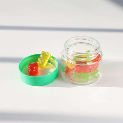 China Smooth Round Glass Weed Flower Candy Storage Container With Child Resistant Screw Cap for sale