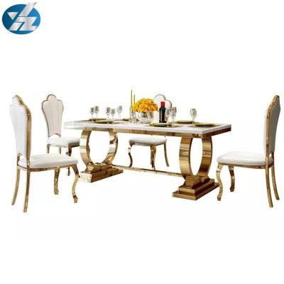 China Modern Italian Design Stainless Steel Glass Top Dining Table for sale