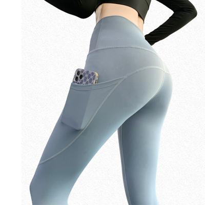 China Breathable Berry Mystery Purple Blue Textured Seamless Yoga Pants Sets With Phone Pocket Sample Pockets for sale