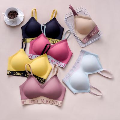 China Custom Removable Traceless Logo Letter Seamless Zero Sense Bralette One Piece Latex Padded Cup Girls Padded Sexy Back Lift Seamless Bra for sale