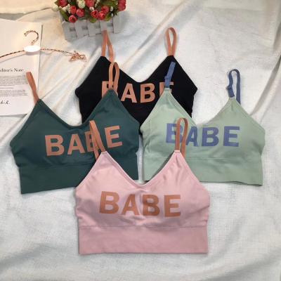 China Breathable Custom Letter Printed Yoga Top Fitness Women's Teen Soft Comfortable Radio Padded Seamless Crop Sports Bra for sale