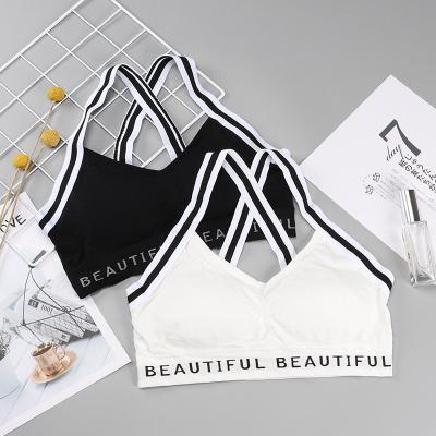 China One Piece Customized Logo Letter Cross Straps Back Sports Fitness Padded Wireless Seamless Bra For Ladies for sale