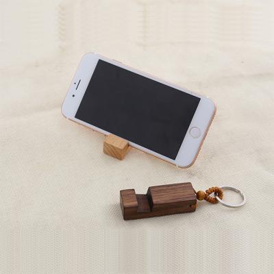 China Wooden 2 in 1 Universal Cell Phone Wooden Bracket Walnut Stand Holder Phone Key Chain for sale