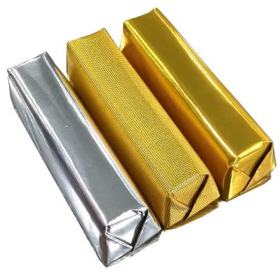 China Food factory wholesale colored self adhesive backed embossed foil backed paper for chocolate candy wrapper for sale