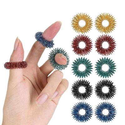 China Hot Selling Colorful Magical Metal Religious Sensory Rings Therapy Lose Weight Acupressure Finger Massager Finger Massage Ring for sale