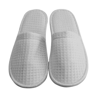 China Wholesale Cheap Disposable Hotel Cotton White Waffle Poly Closed Toe Unisex Disposable Slippers for sale