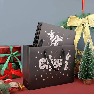 China 100% Eco-Friendly Beauties Black Kraft Handled Paper Bags With Merry Christmas for sale