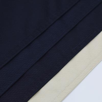 China Waterproof Stock Lot Printed Yarn Dyed Polyester Cotton Spandex Fabric Woven Twill For Men Shorts Pants for sale