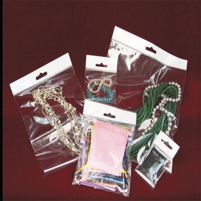 China Customized OPP Resealable Plastic Self Adhesive Clear Bag With Hook For Small Gift Jewelry Earrings Packaging Pouch Bags for sale