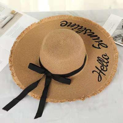 China Picture Weave Letter Sun Hats For Women Black Ribbon Lace Up Big Brim Straw Hat Outdoor Beach Summer Hat for sale