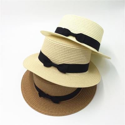 China Fashionable female British image bow straw hat small top hat all-match summer flat sun beach hat for sale