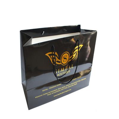 China Recycled Materials Customized Gold Foil Logo Shoes Packaging Paper Bag Manufacturers for sale