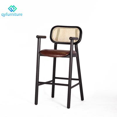 China Mid Century Modern Design Rattan Backrest Black Wood Frame Bar Stool Chair With Leather Seat for sale