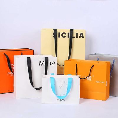 China Branded Orange Custom Luxury Recycled Logo Materials Wholesale Boutique Packaging Retail Paper Bags Euro Printed Garment Tote Bag Gift Bag for sale