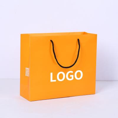 China Recycled Materials Luxury Fashion Custom Design Logo Printing Eco Friendly Shopping White Cardboard Packaging Paper Bags With Handle for sale