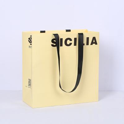 China Recycled Materials Recycled Custom Luxury Paper Bags And Gift Boxes With Handle For Shopping Bag With Your Own Logo for sale