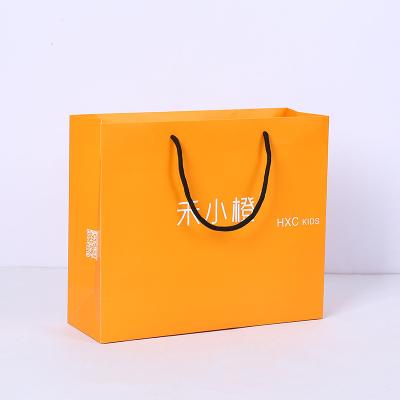 China Recycled Materials Customized Printed Jewelry Paper Gift Bags With Bow Logo Luxury Shopping Packaging Bag Custom Made for sale