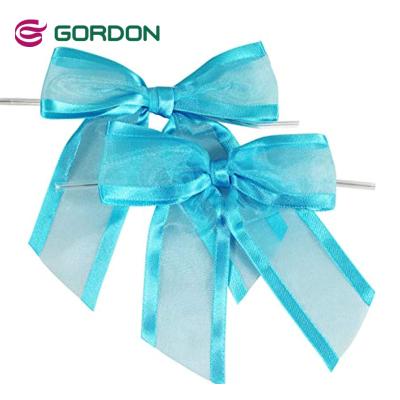 China Eco-friendly Mini Christmas Ribbon 100% Polyester 16mm Satin Edge Organza Ribbon Pre Tied Hangs Ribbons For Gift Wrap for sale