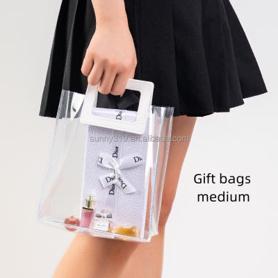 China Shock Resistance Custom Logo Transparent Holographic Pvc Tote Bag Plastic Shopping Bag Gift Bag for sale