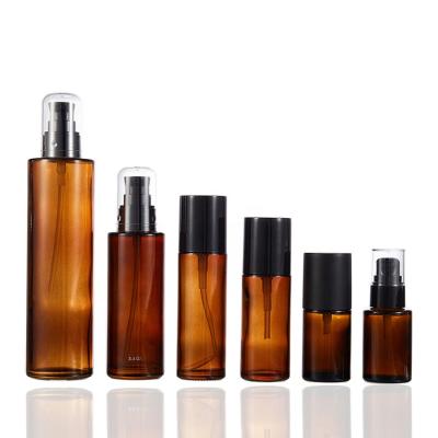 China Wholesale Cosmetic Packaging Empty Cosmetic Amber Clear Glass Bottle With Plastic Cap 30ml 40ml 60ml Lotion Pumper 100ml Round Bottle for sale