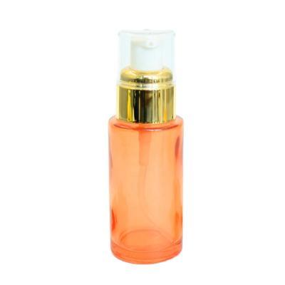 China Luxury Orange Cosmetic Packaging Packaging Skin Care Round 30ml Empty Lotion Pump Bottle In Stock for sale