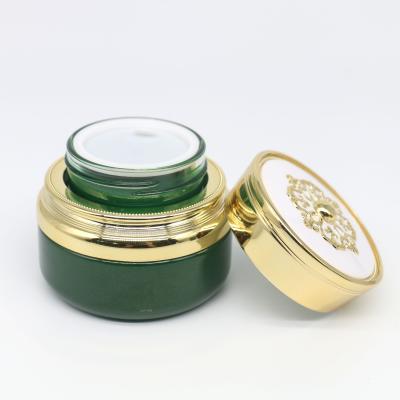 China 1oz/30g Personal Care Luxury Green Color Empty Natural Cosmetic Glass Jar With Paper Box For Skin Care Packaging Cream for sale