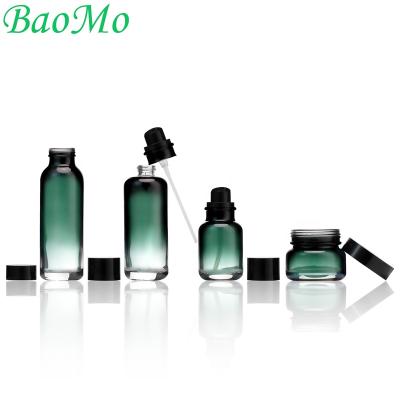 China New And Luxury Color Luxury Cosmetic Glass Bottle Set Round Cosmetic Bottles And Jars Set Lotion Packaging Bottle Glass Green Set for sale