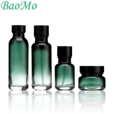 China New and luxury Frost Green Luxury 50g 40ml 100ml 120ml glass cosmetic jar bottle manufacturer and pump bottle for skincare packaging for sale