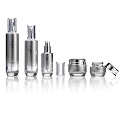 China New and luxury 30g 50g 40ml 100ml 120ml luxury matte silver cosmetic packaging glass jar and pump bottle with silver tops for serum cream for sale