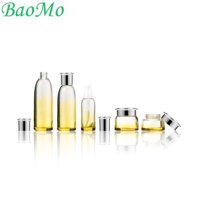 China New and Luxury 40ml 100ml 120ml See-thought Luxury Yellow Coat Spray Cosmetic Glass Bottles for Serum and Detergent for sale