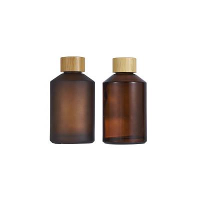 China Hot Sale 200ml Personal Care Glass Frosted Amber Cosmetic Packaging Essential Oil Bottle for sale