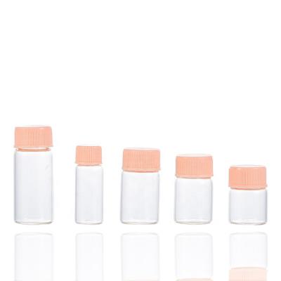 China Luxury eco-friendly cosmetic clear glass bottle set round vial personal care glass skin care packaging with pink cap for sale