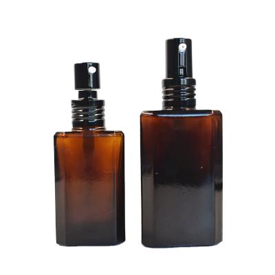 China New Beautiful Cosmetic Packaging 30ml 60ml Square Spray Amber Glass Bottle For Massage Oil for sale