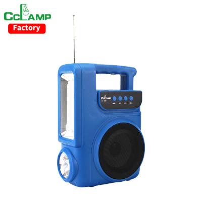 China Home CCLAMP All In One Handy BRITE Solar Built-in FM Radio Speaker Quality Lighting System Solar Lamp and Mobile Charging Function for sale