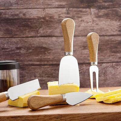 China Viable Cheese Knives With Wooden Handle Stainless Steel Cheese Slicer Cheese Cutter For Family Gath for sale