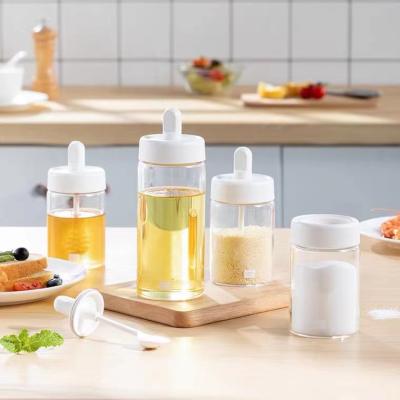 China Viable Drop Shipping Bpa Free Salt Bottles Glass Shaker Bottle Jam Spice Jar Clear Seasoning Container With Spoon Brush for sale