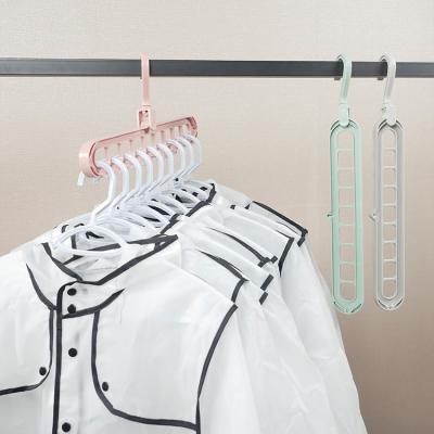 China 9 Hole Multifunctional Space Saving Clothes Hanger 360 Rotating Magic Plastic Folding Hanger for sale