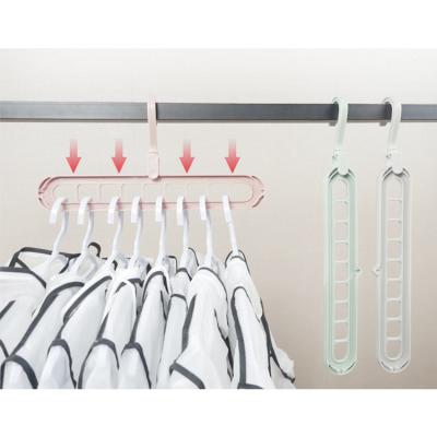 China Excellent Quality Multifunctional 9 Holes Magic Clothes Coat Hanger Space Saving for sale