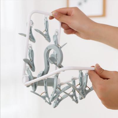 China Windproof Non-slip Collapsible Plastic Clip Hanger Non-Slip Windproof Laundry Drying Rack for Children's Clothes for sale