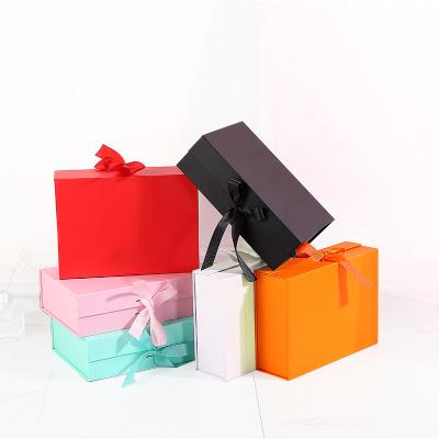 China Custom Paper Box Pink Ad Folding Luxury Flat Pack Custom Ribbon Closures Book Formed Lid Foldable Packaging Magnetic Gift Box for sale